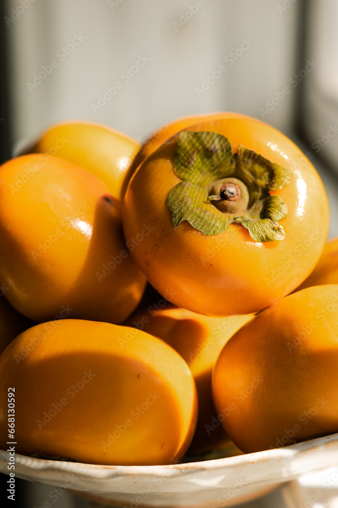 persimmon fruit on a plate