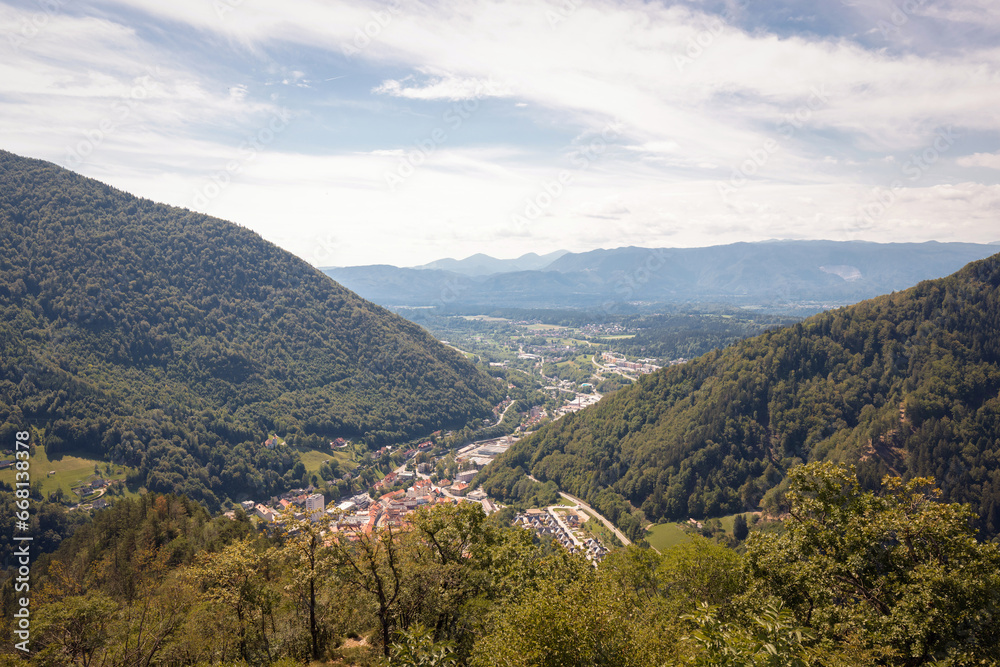 Fototapeta premium Mountain landscape with green forests and blue summer sky