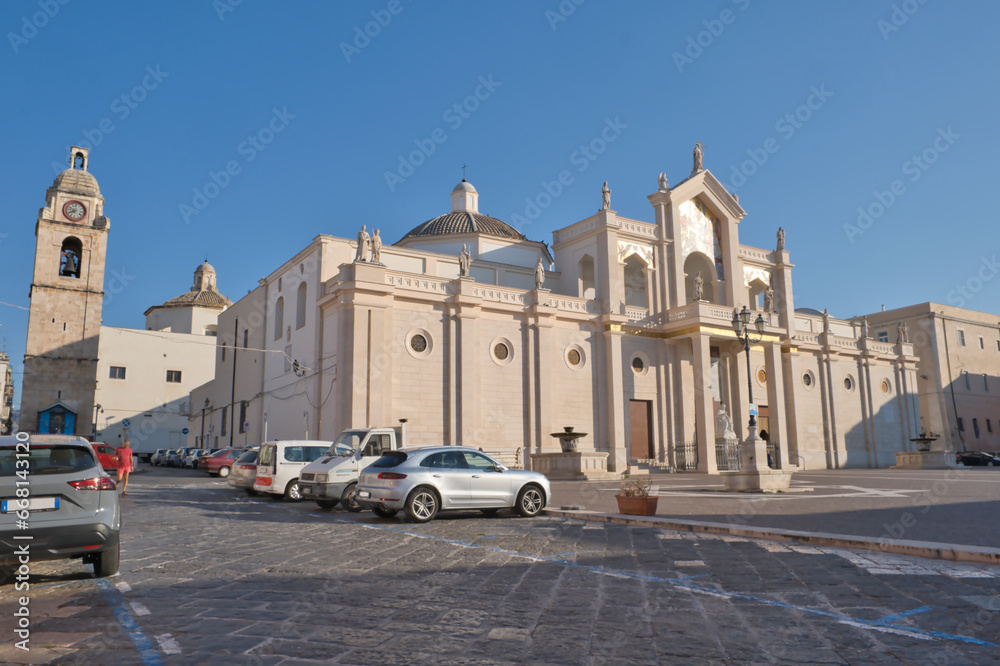 The Cathedral of Manfredonia, San Lorenzo Maiorano, with bell tower behind, blue sky