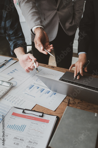 Konstfotografi Group of businessmen working together to calculate income, They are revising the financial numbers, Take out financial documents and check them with a calculator, financial idea