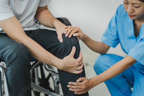 osteoarthritis physical therapist Therapy and help patient exercise and treat young athlete's injured knee. Wound rehabilitation, physical therapy, recovery concept