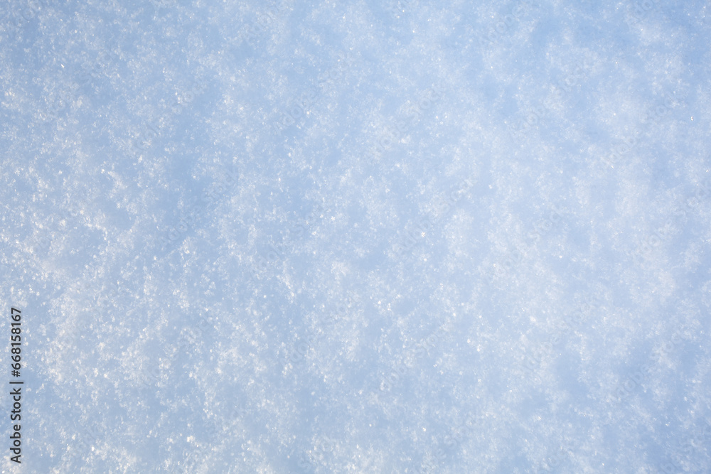 Sparkling freshly fallen snow on a winter day. Background.