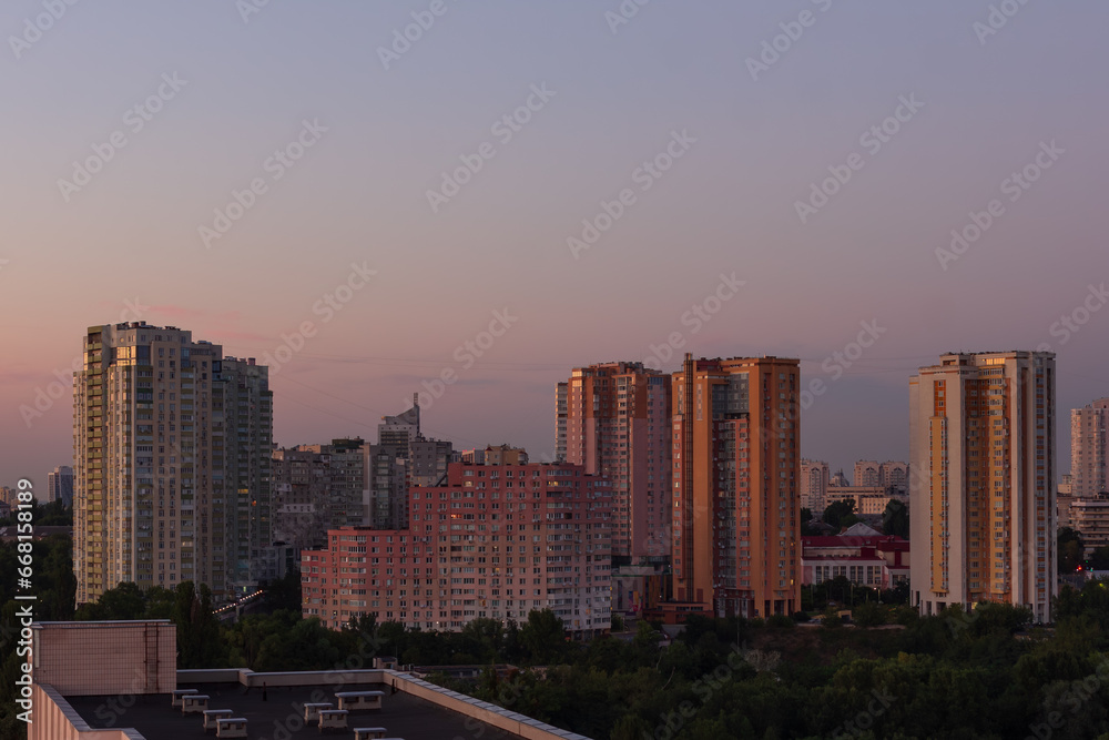 Apartment buildings in one of the districts of the city during the evening hours Apartment buildings in one of the districts of the city during the evening hours
