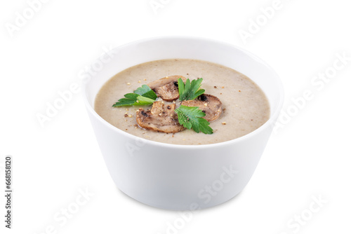 Roasted mushroom potato puree soup in a bowl on a white isolated background