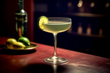 Close up of gimlet cocktail with lime garnish in background of modern bar or house. Lifestyle concept of restaurants and bar.