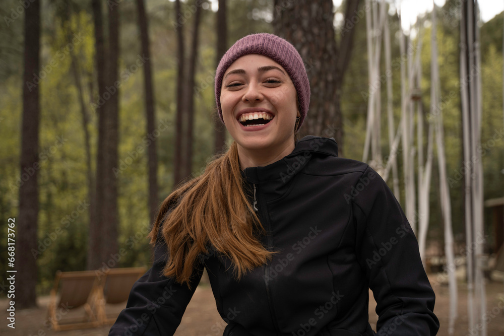 Outside a Glamping , The smiling girl holds a cup of coffee outdoors during the fall. Outside a Glamping , The smiling girl holds a cup of coffee outdoors during the fall.