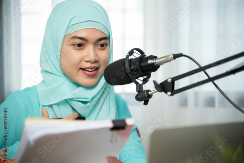 Photography Muslim woman broadcasting from radio station.