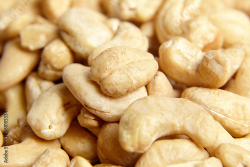 Cashew nut heap food texture background, macro shot. Dry cashew fruit