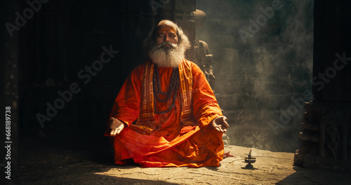 Εκτύπωση καμβά Authentic Shot of An Indian Senior Monk Practicing Yoga In A Temple Setting