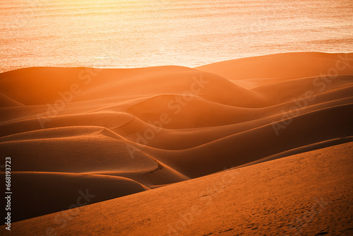 Closeup of curvy dunes at sunset in Namib Desert  south of Walvis Bay in the Namib-Naukluft National Park  Namibia.b