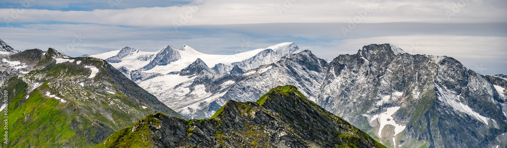 Majestic alpine panorama with glacier mountain of Grossvenediger. The main peak of the Venediger Group in Hohe Tauern mountain range. Austrian Alps, Austria. Majestic alpine panorama with glacier mountain of Grossvenediger. The main peak of the Venediger Group in Hohe Tauern mountain range. Austrian Alps, Austria.
