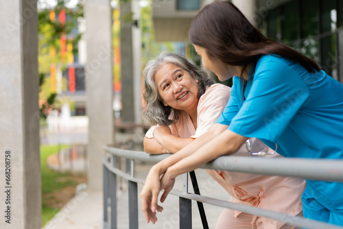 Caregiver for elderly talking with depression, dementia senior woman for protection melancholy trouble. Asian aging suffering from depression. Caregiver or nurse support happy retirement service.