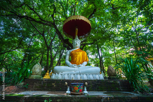 Old Buddha statue in Wat Chet Yot or Wat Photharam Maha Wihan  seven pagoda temple It is a major tourist attraction in Chiang Mai  Thailand.with evening Temple in Chiang Mai.
