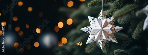 3D origami white alternative paper Christmas tree ornaments. White background, web banner, postcard with paper christmas ornaments made from paper photo
