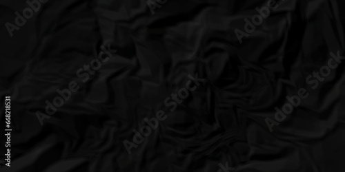 Dark crumple black fabric paper wrinkled poster template ,blank glued creased paper texture background. black paper crumpled backdrop background. used for cardboard and clerk board.