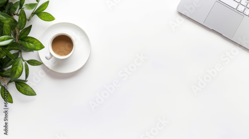 Laptop computer with a coffee cup from above