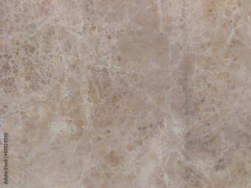 An old marble wall with scuffs and damage. Grey marble background.