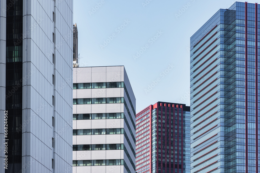 high rise buildings with blue sky in Tokyo, Japan