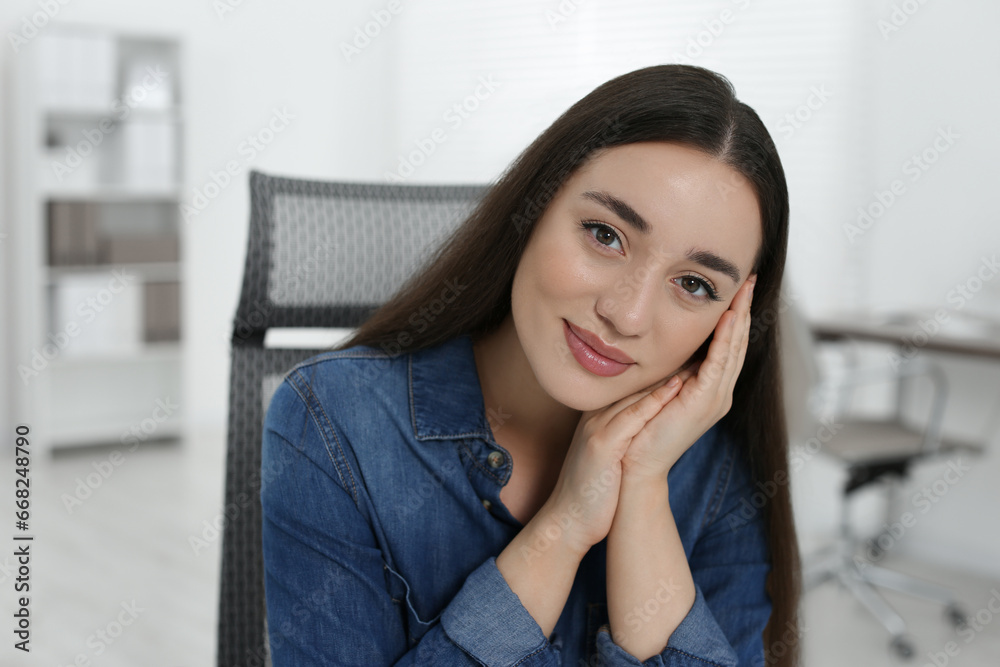 Portrait of beautiful young woman in office Portrait of beautiful young woman in office