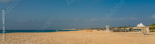 Sandy beach with a boat in Santa Maria on Cape Verde Island Sal