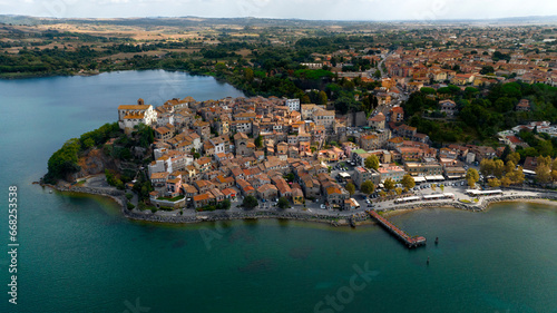 Aerial view of the historic center of Anguillara, in the metropolitan city of Rome, Italy. The town is located on the shores of Lake Bracciano. photo