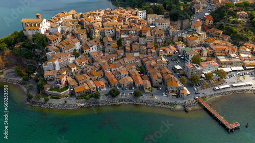 Aerial view of the historic center of Anguillara, in the metropolitan city of Rome, Italy. The town is located on the shores of Lake Bracciano.