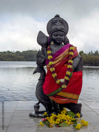 Statue of Lord Muruga at Ganga Talao lake in Mauritius photo