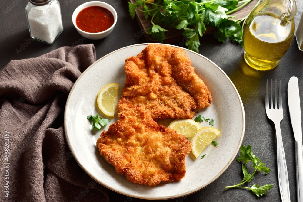 Schnitzel with lemon and leaves of parsley