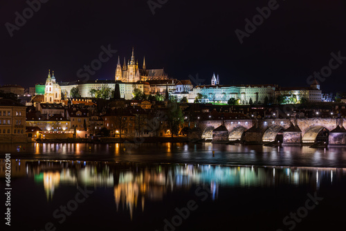 Illuminated night view of the charles bridge and Hradcin castle in Prague, Czech Republic © Picturellarious
