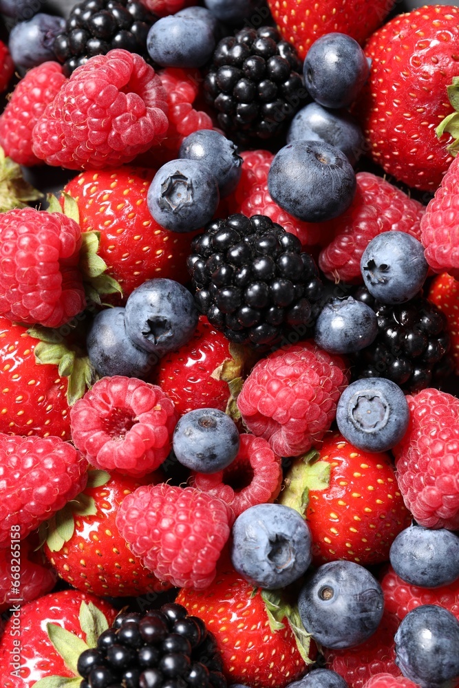 Assortment of fresh ripe berries as background, top view Assortment of fresh ripe berries as background, top view