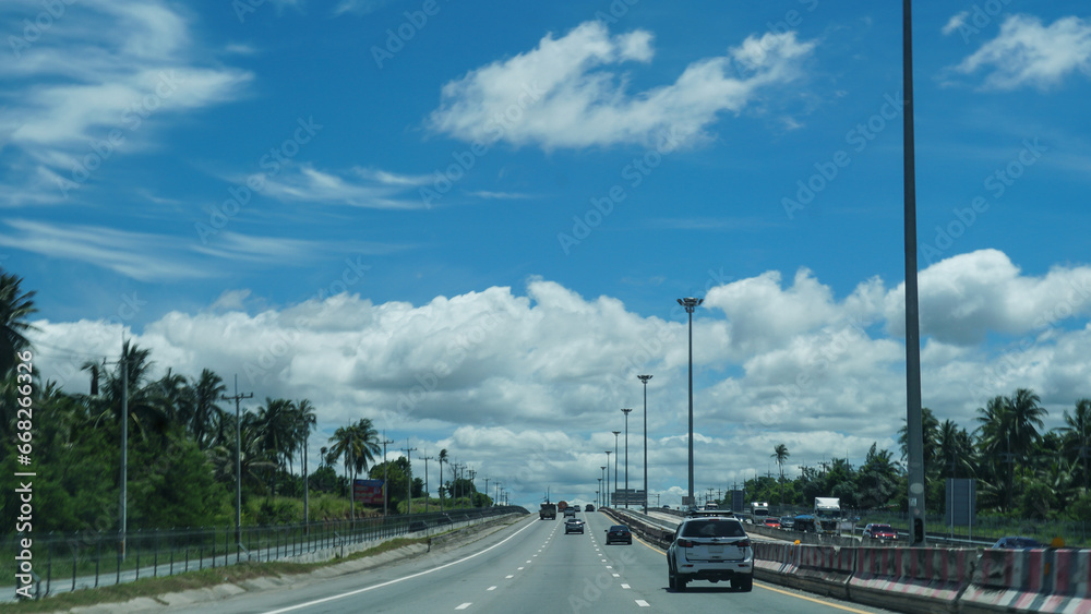 Beautiful sky and cloud at the motor way in Thailand, Car driving on high way road, Car on road.