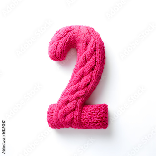 knitted number 2 from yarn, creative handcrafted idea of decoration, monochrome concept, funny crochet toy number
