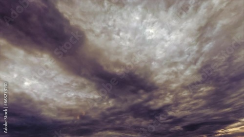 pretty sky timelapse with heavy leaden rain clouds - loop video