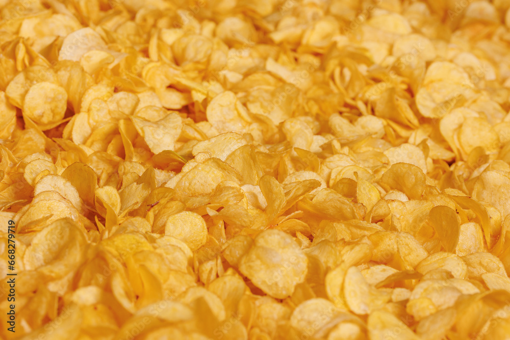 Fresh Crispy potato chips snack texture background, top view Fresh Crispy potato chips snack texture background, top view