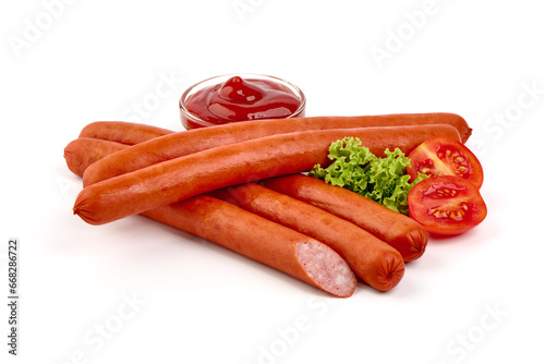 Hungarian smoked pork sausages with lettuce, isolated on white background.