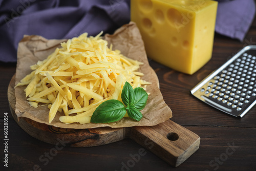 Grated cheese  on a cutting  board