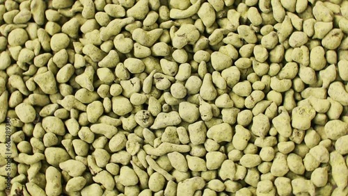 Ginseng Oolong Tea bunch, LAN GUI REN Classic green Chinese tea. Chinese oolong tea drink rolled in ginseng powder used for weight loss. Wulong Tea Granulars. Rotating. Background.