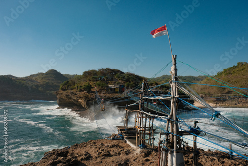 Timang Beach Island View with Indonesia Flag, Capturing the Foamy Sea photo