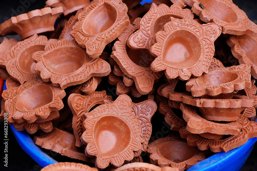 Traditional Colorful Diwali diya or clay lamp for sale at Pune, India market in Diwali festival.