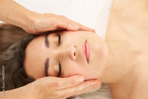 woman receiving a facial massage