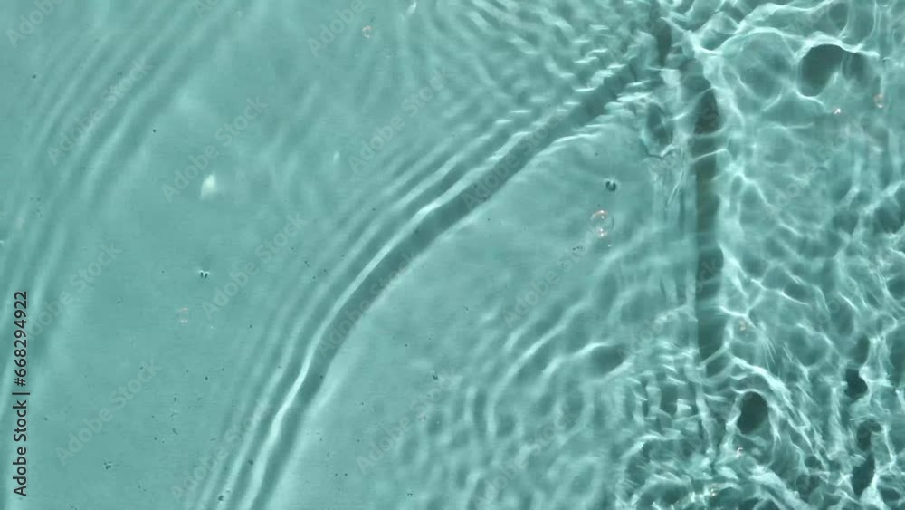Blue water texture background on the noon sunlight. Blue water texture background on the noon sunlight.