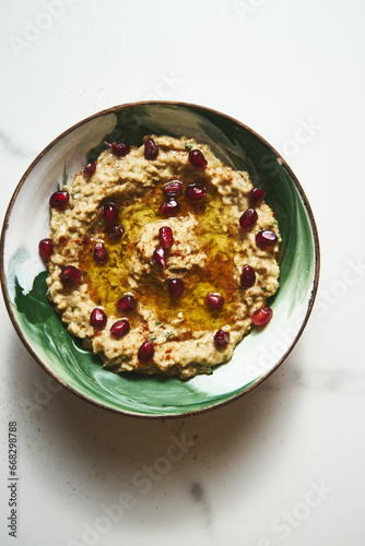 Baba ganoush. A smoky Middle Eastern dip made from roasted eggplants, blended with tahini, lemon juice with garlic and olive oil. often garnished with parsley and served with pita bread.