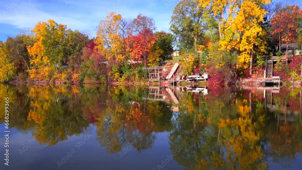Amazing peak Fall colors by the riverside mid October in Wisconsin, moving aerial view.
Amazing peak Fall colors by the riverside mid October in Wisconsin, moving aerial view.