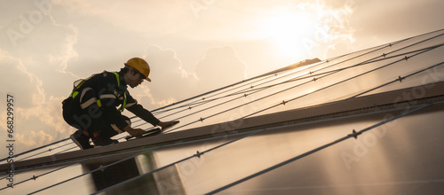 Techniques checking solar cell on the roof for maintenance. Service engineer worker install solar panel. Clean energy concept..