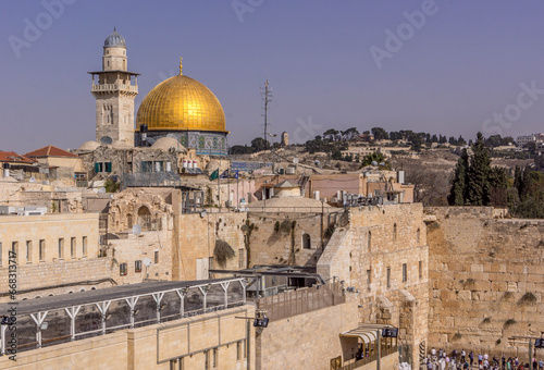 The Dome of the Rock and Western Wall (Wailing Wall), the Muslim and Jewish religious shrines, with the pilgrims in Old Town of Jerusalem, Israel.