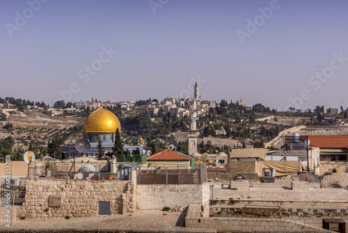 The golden roof of the Dome of the Rock, the Muslim religious shrine, over the roofs of Old Town of Jerusalem, Israel.