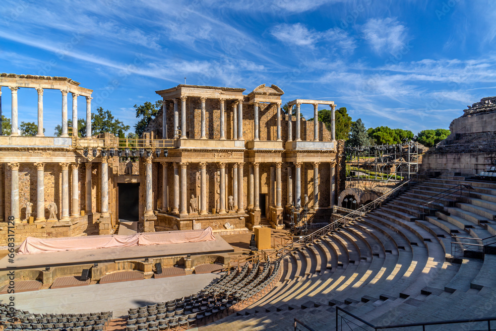 Granite stands and part of the stage of the Roman Theater of Mérida with the scaffolding, spotlights, stage and chairs placed under the stands prepared for the International Classical Theater Festival