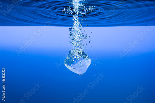 ice cube under water ripples