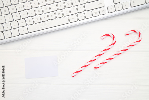 Credir card mockup near keyboard and Christmas and New Year decoration