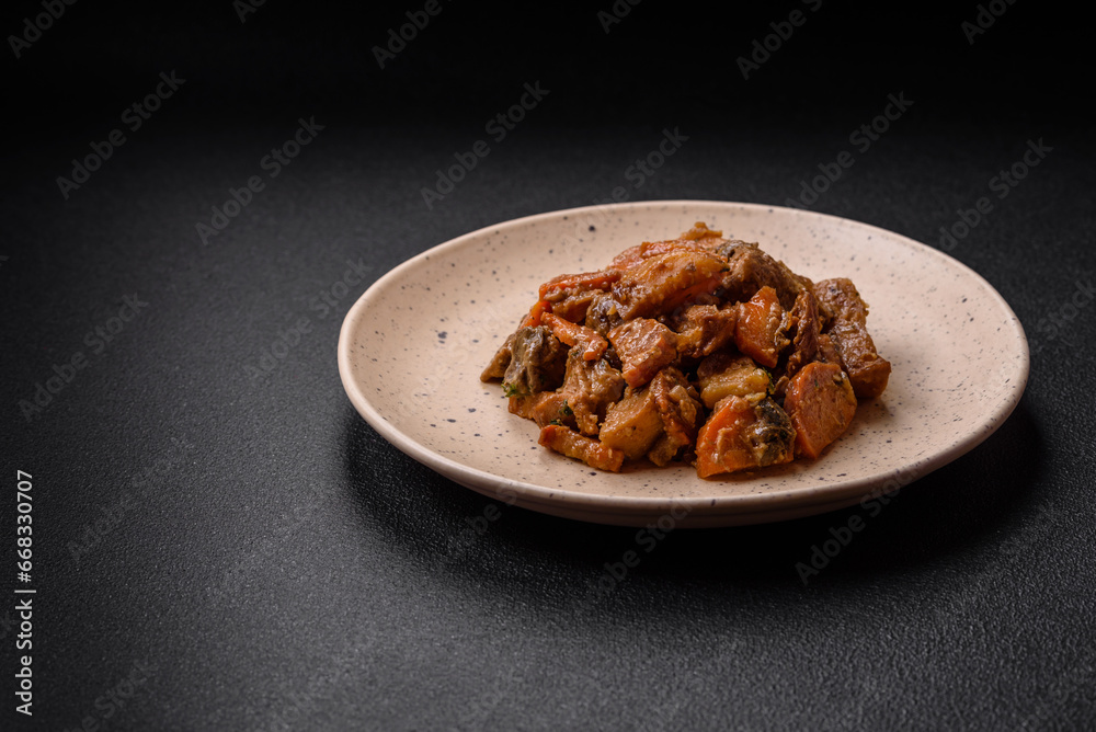 Delicious vegetable stew of potatoes, beef meat, mushrooms, carrots, salt, spices and herbs Delicious vegetable stew of potatoes, beef meat, mushrooms, carrots, salt, spices and herbs